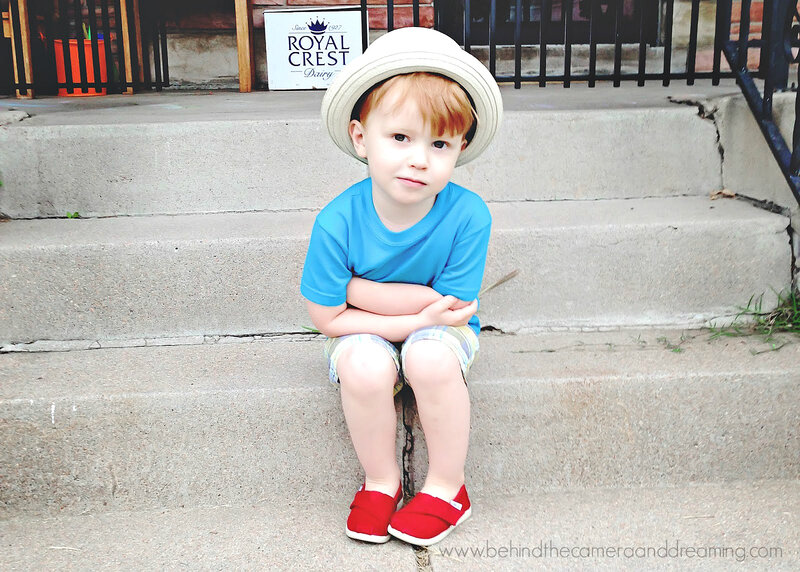 Young Boy Sitting on Steps