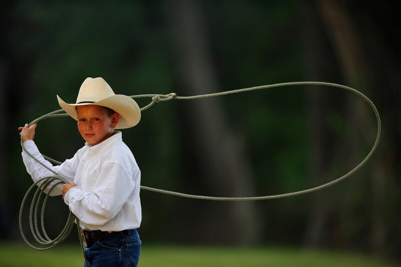 Young cowboy with lasso