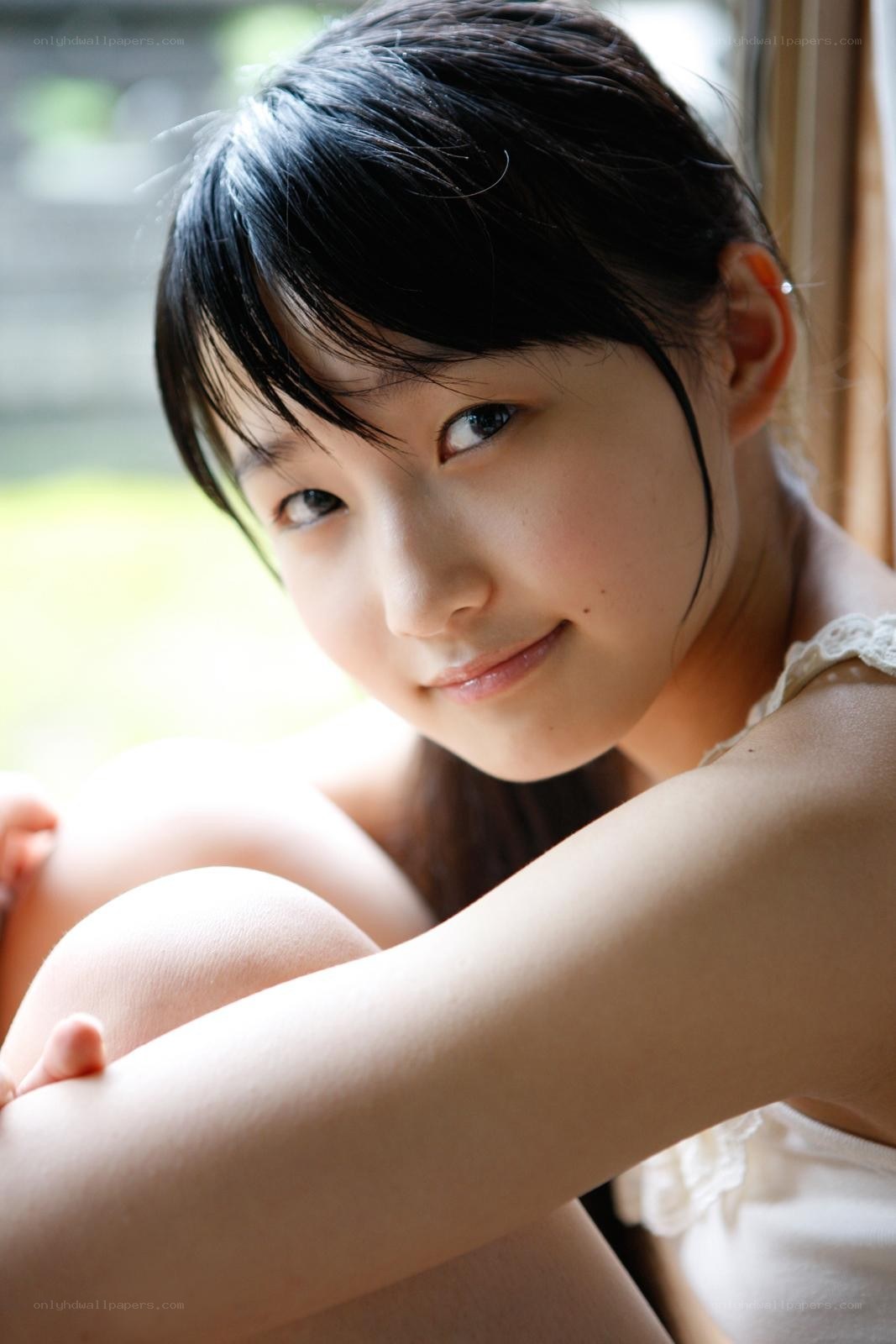 young girl by window