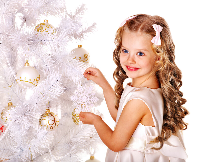 Young Girl Decorating Tree