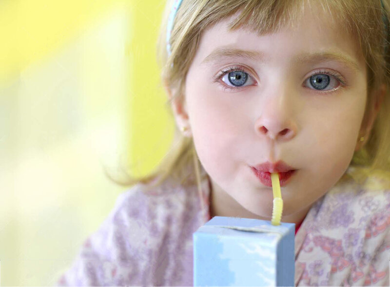 Young Girl Drinking Juice