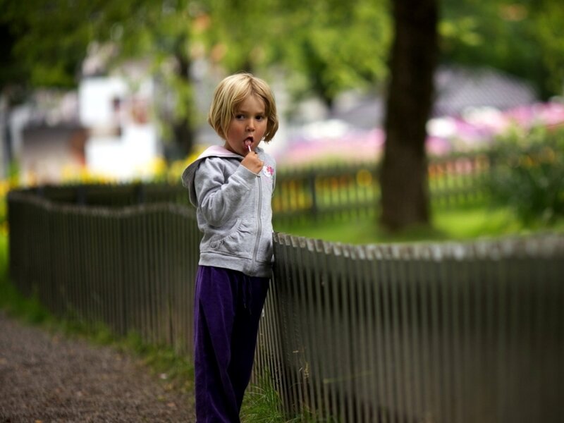 Young Girl Eating Lollipop