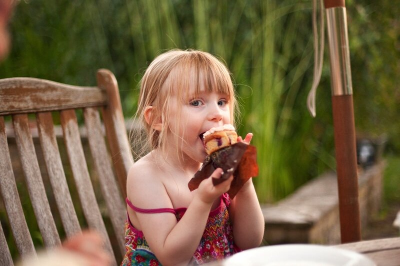Young Girl Eating Pastry