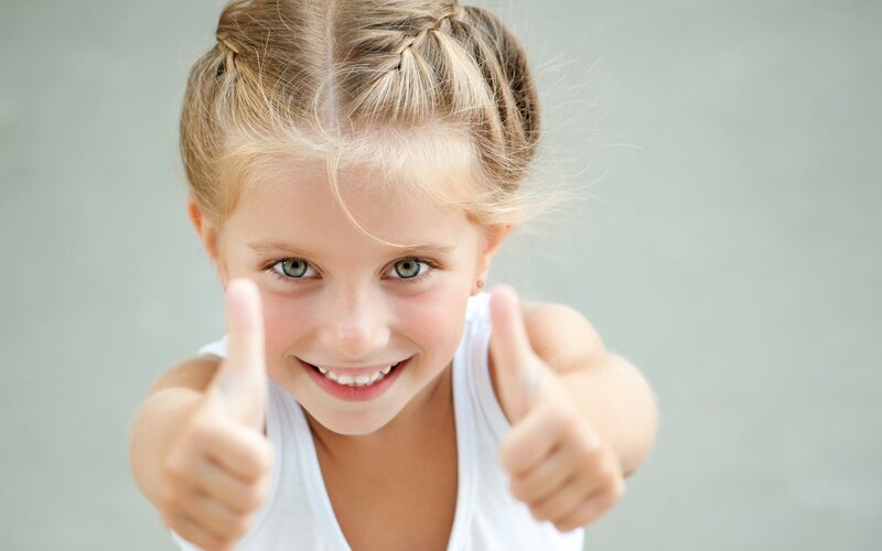 Young Girl Giving Thumbs Up