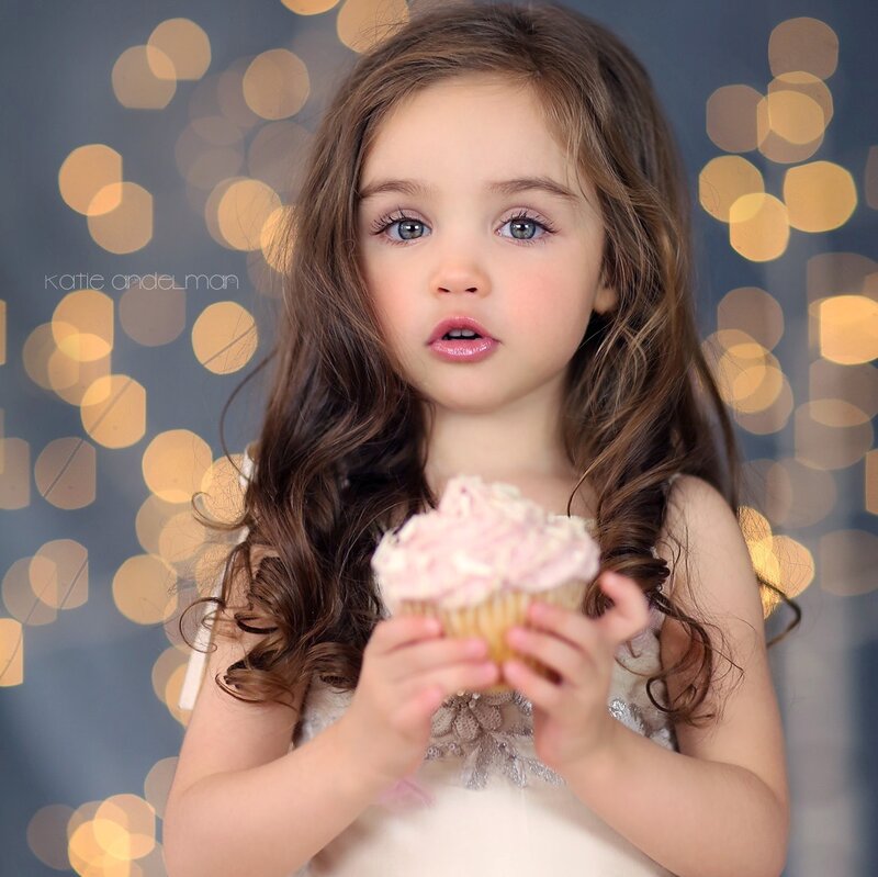 Young Girl Holding Cupcake