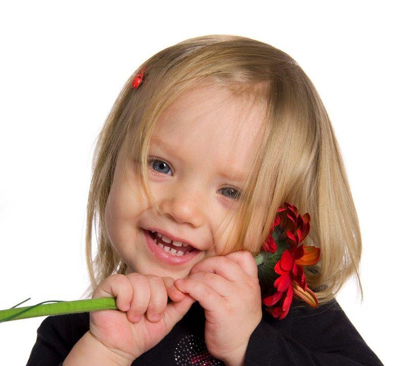 Young Girl Holding Flower