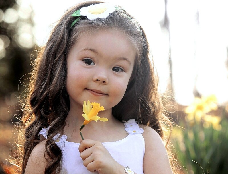 Young Girl Holding Flower — White