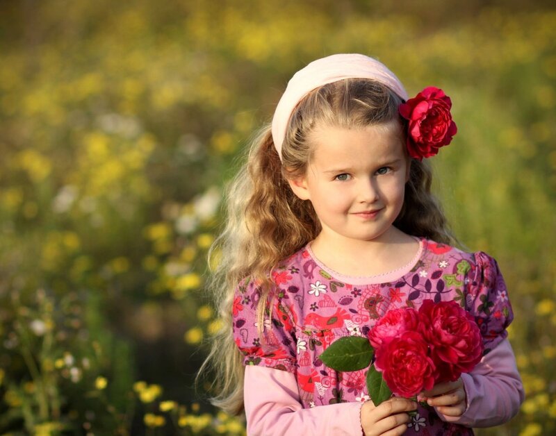Young Girl Holding Flowers — Pink