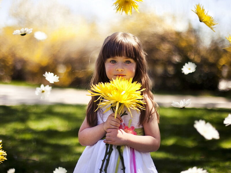 Young Girl Holding Flowers — Yellow
