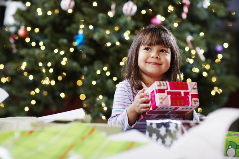Young Girl Holding Gift — Green