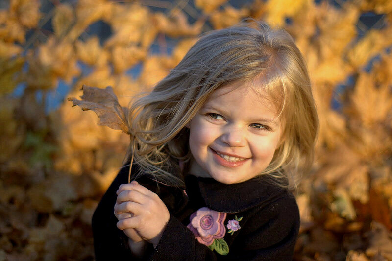 Young Girl Holding Leaf