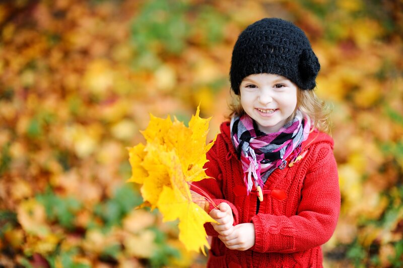 Young Girl Holding Leaves — Red