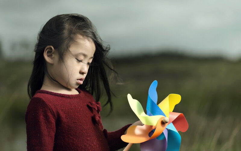 Young Girl Holding Pinwheel