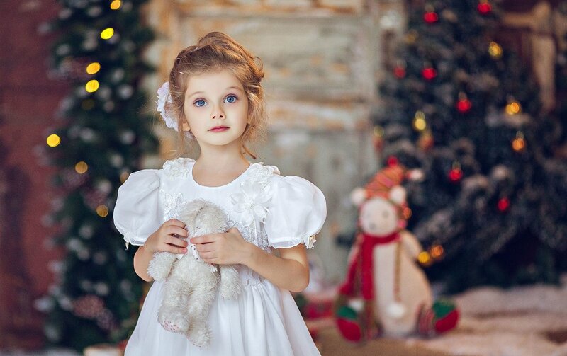 Young Girl Holding Teddy Bear