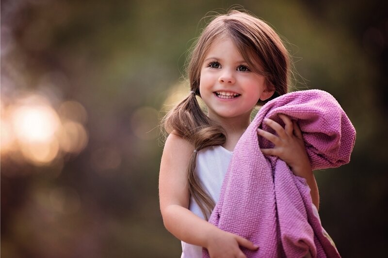 Young Girl Holding Towel
