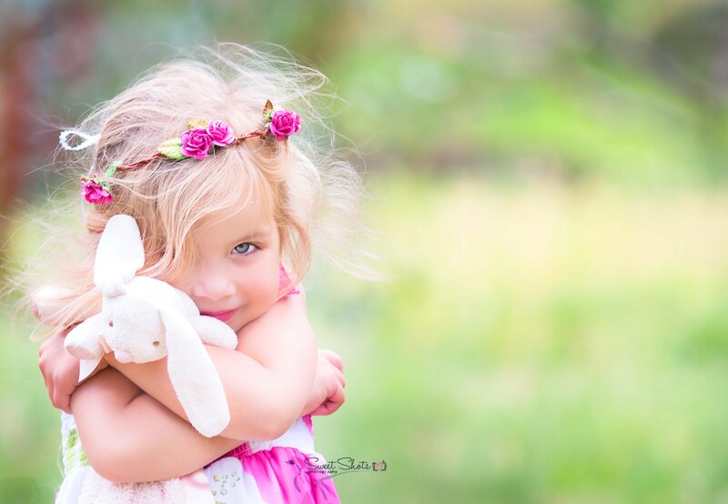 Young Girl Hugging Bunny