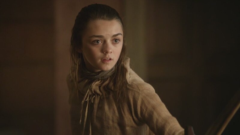 young girl in a dimly lit room