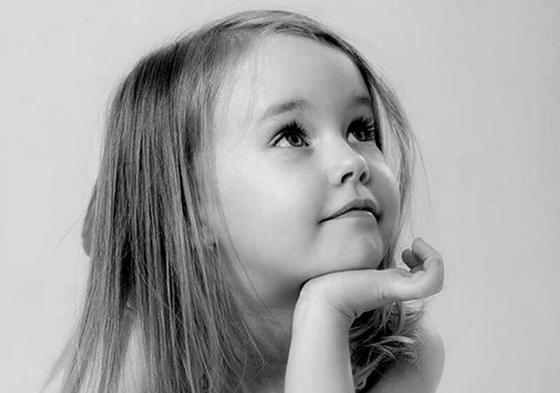 Young Girl in Black and White — Contemplative