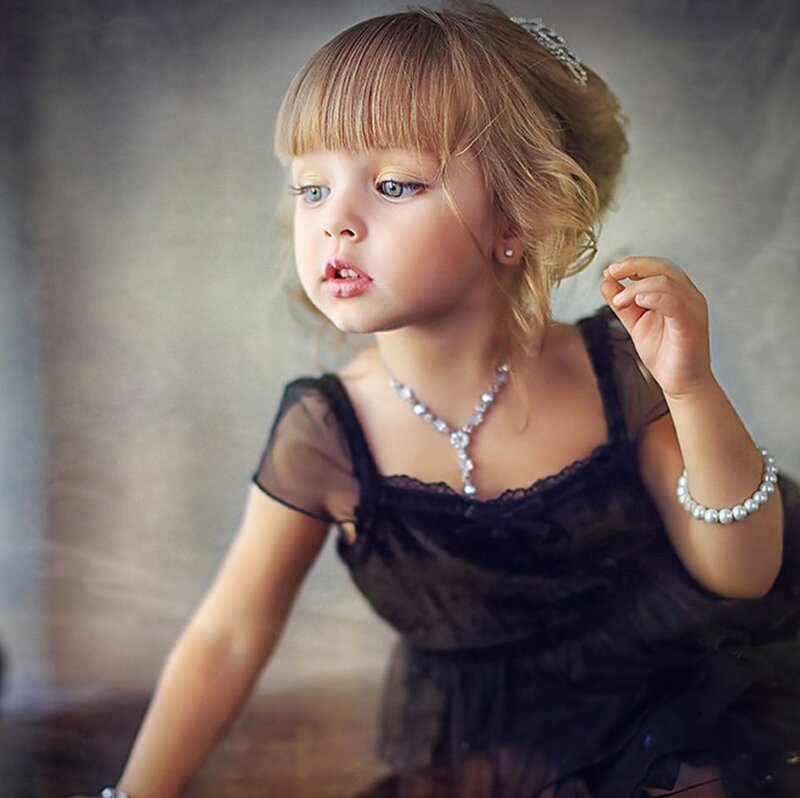 Young Girl in Black Dress — Dramatic