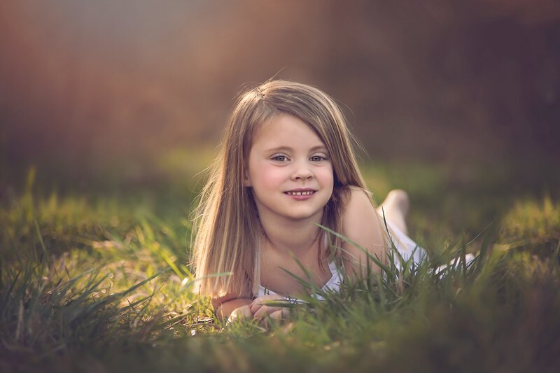 Young Girl in Grass — Green, Serene, Sunset