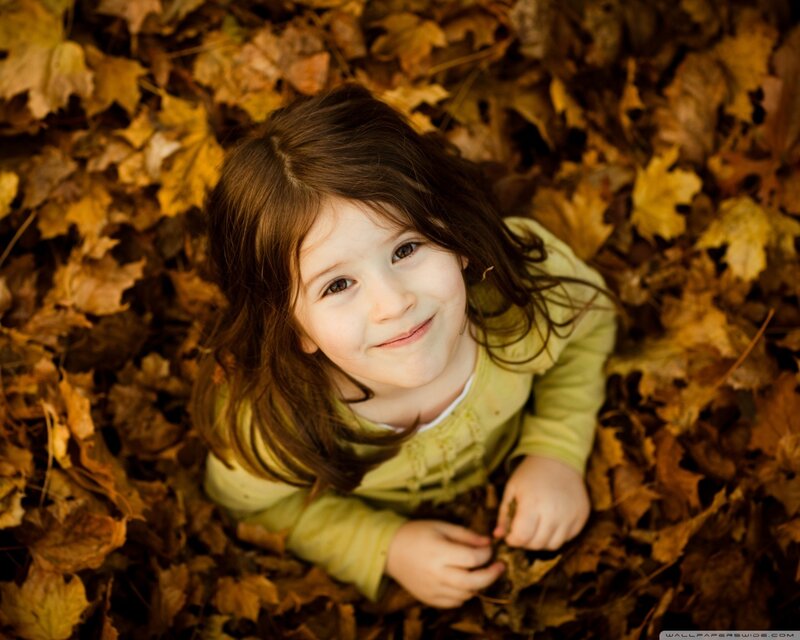 Young Girl in Leaves — Brown, Peaceful