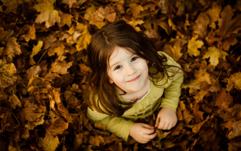 Young Girl in Leaves
