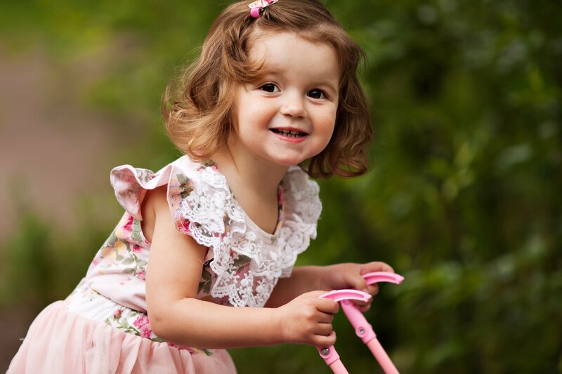 Young Girl in Pink Dress — Playful, Afternoon