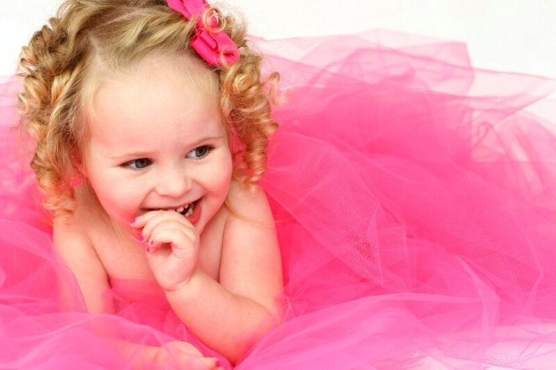 Young Girl in Pink Dress — Playful