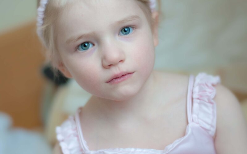young girl in pink dress