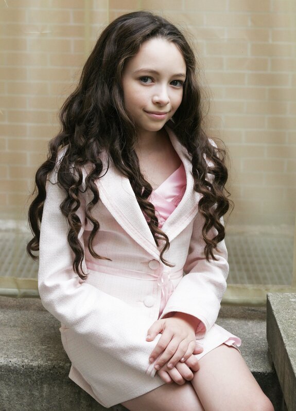 Young girl in pink suit