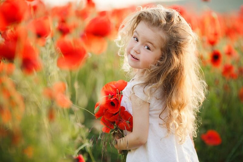 Young Girl in Poppy Field