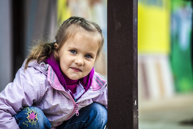 young girl in purple jacket