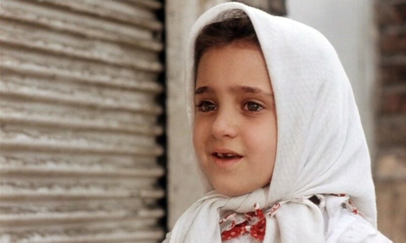 young girl in white headscarf