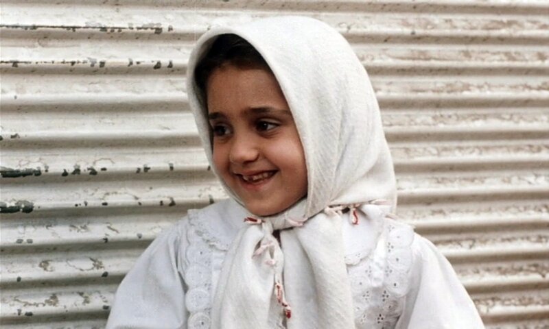 young girl in white headscarf