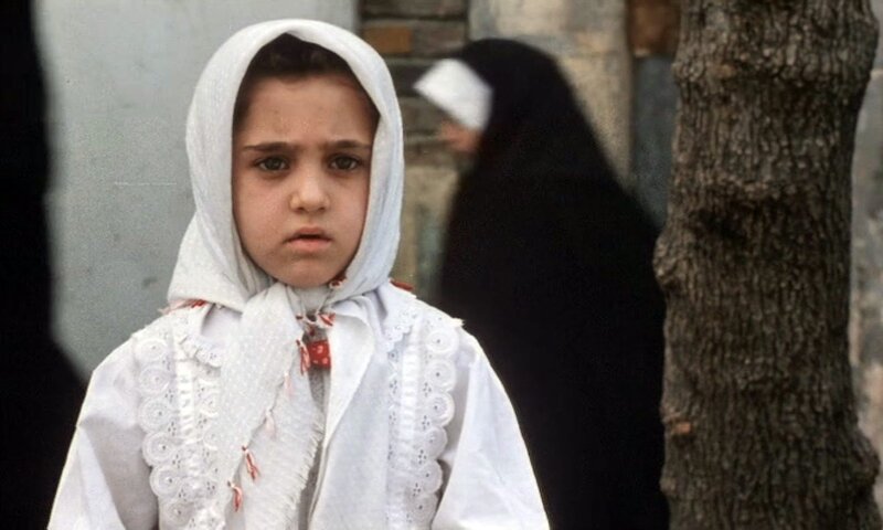 young girl in white headscarf