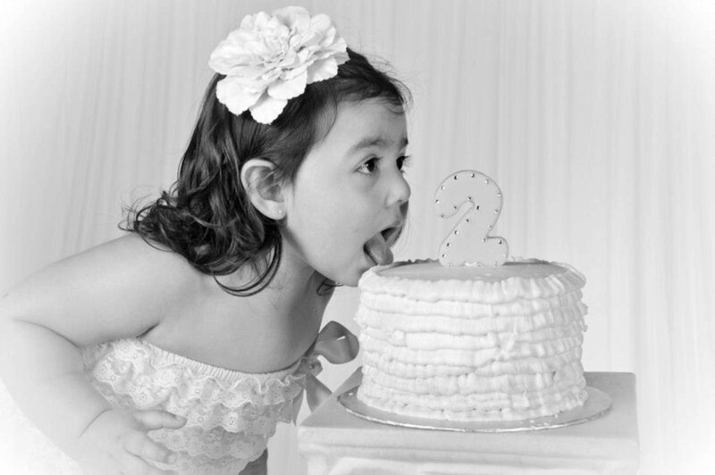 Young Girl Licking Cake