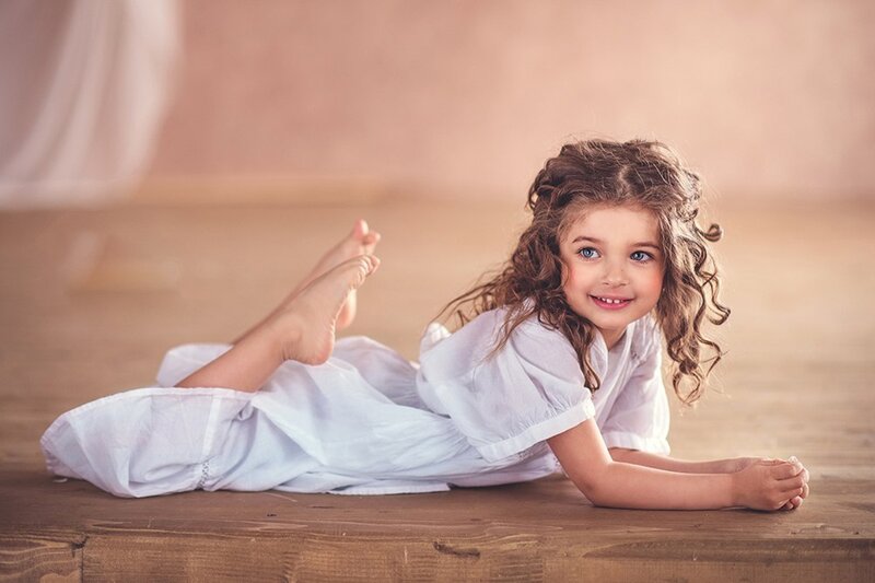 Young Girl Lying on Floor