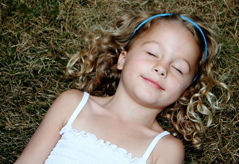 Young Girl Lying on Grass — Green
