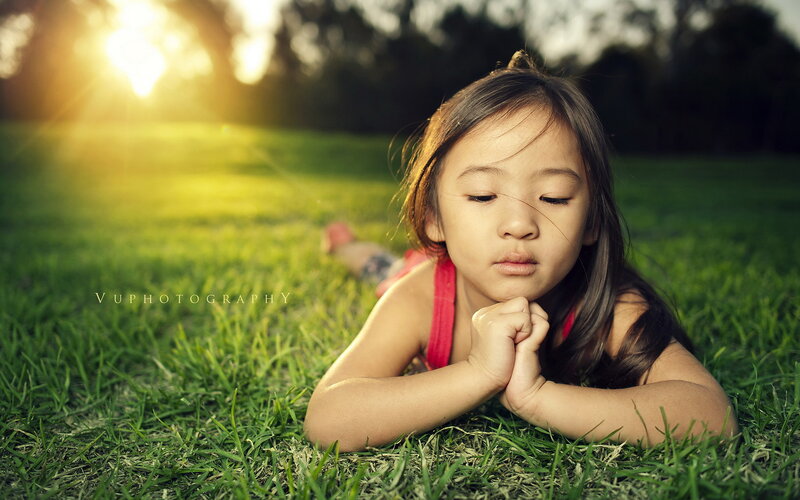 Young Girl Lying on Grass