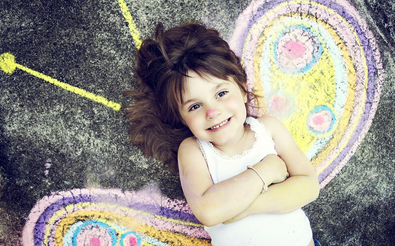 Young Girl Lying on Ground