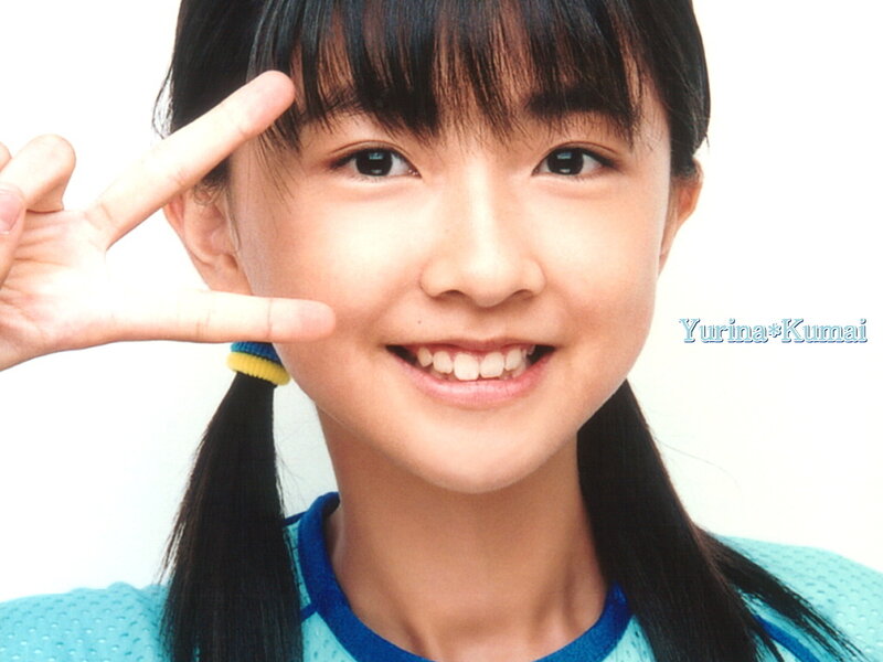 Young girl making peace sign