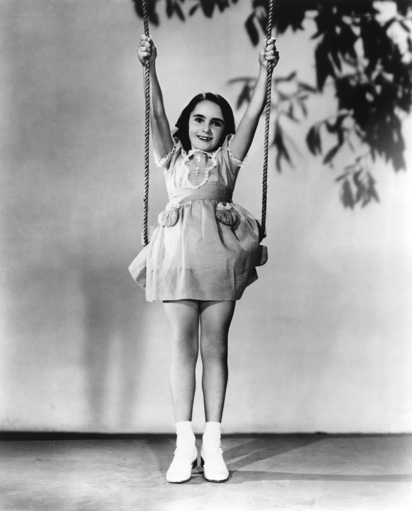 Young girl on a swing
