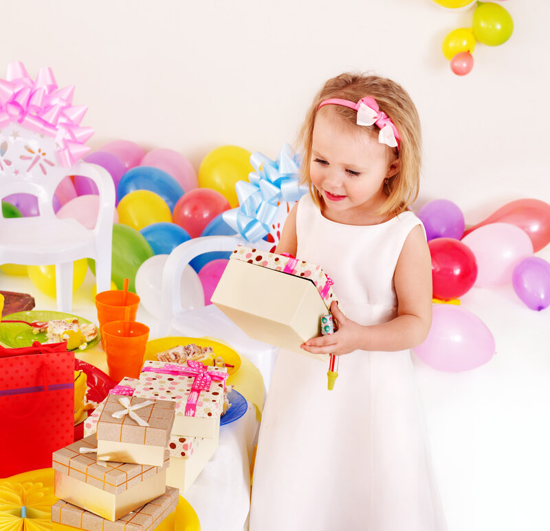 Young Girl Opening Gift