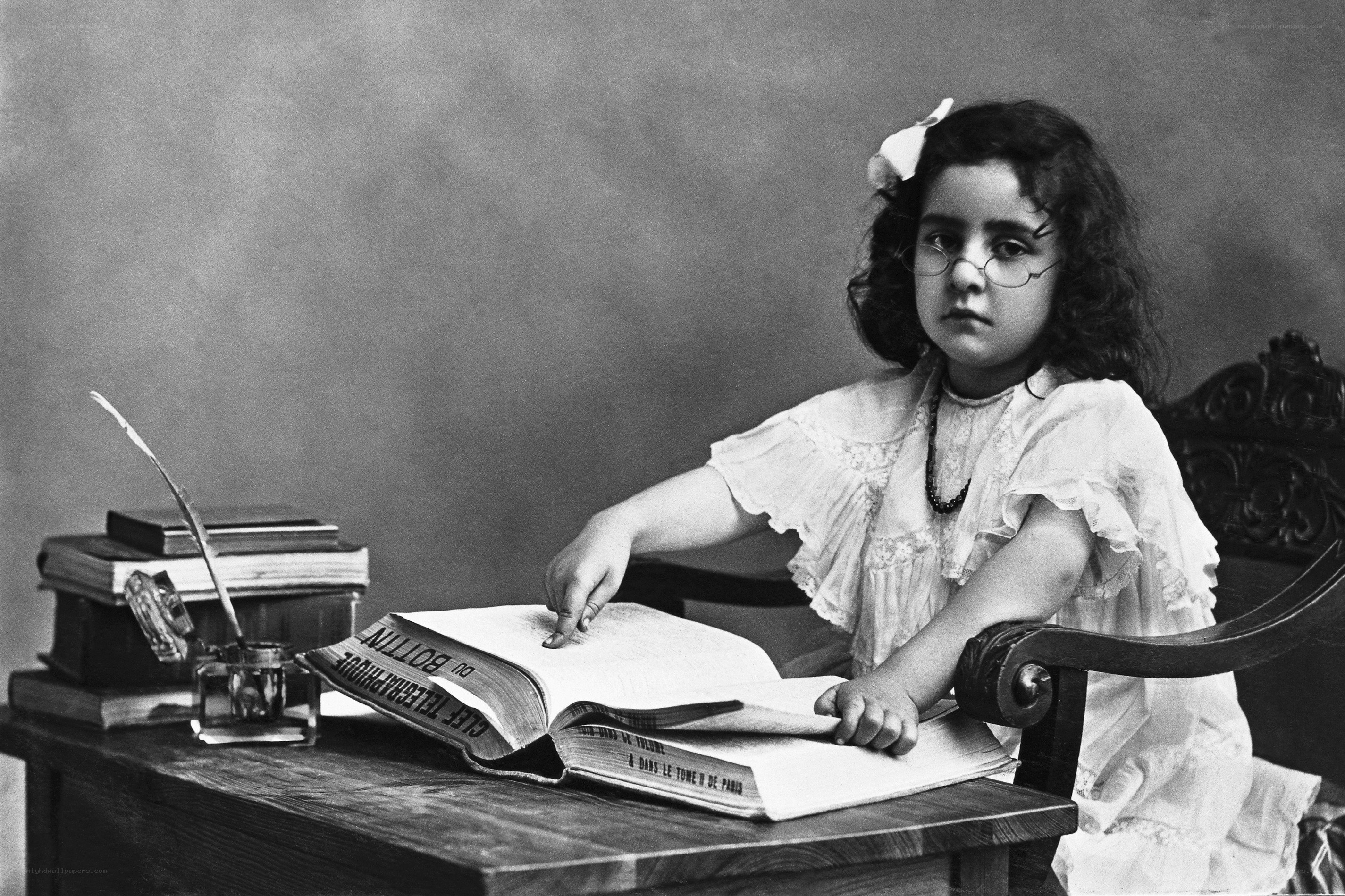 Young girl reading at a desk
