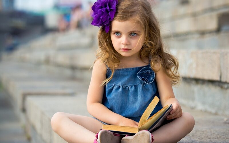Young Girl Reading Book — Blue