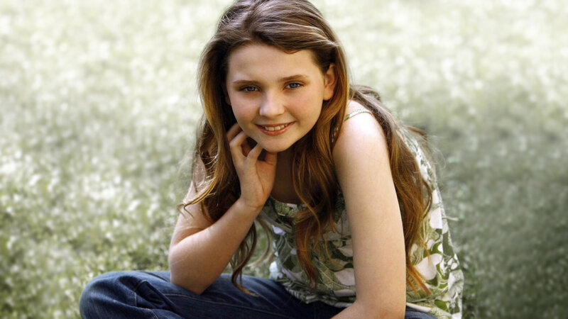 Young Girl Sitting Outdoors