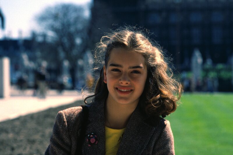 Young girl smiling outdoors