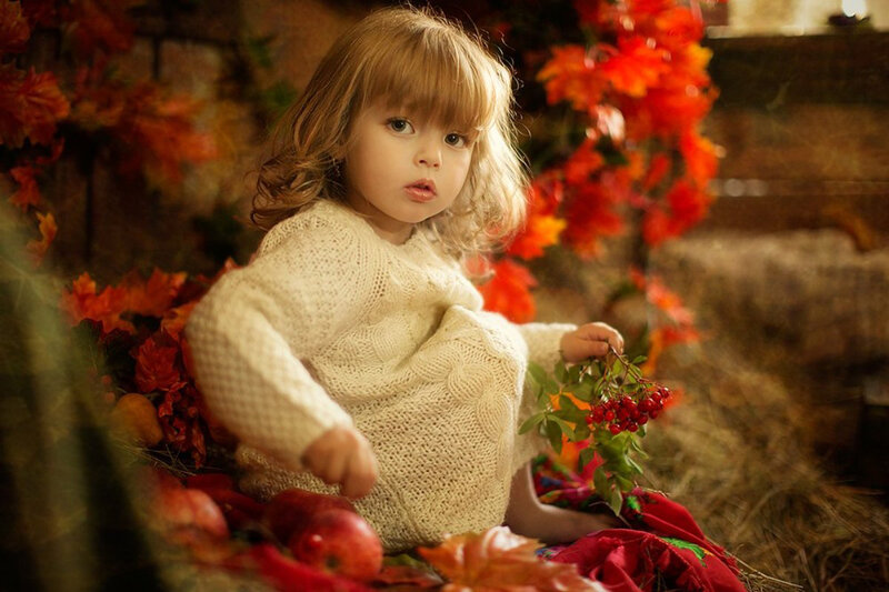 Young Girl with Autumn Leaves