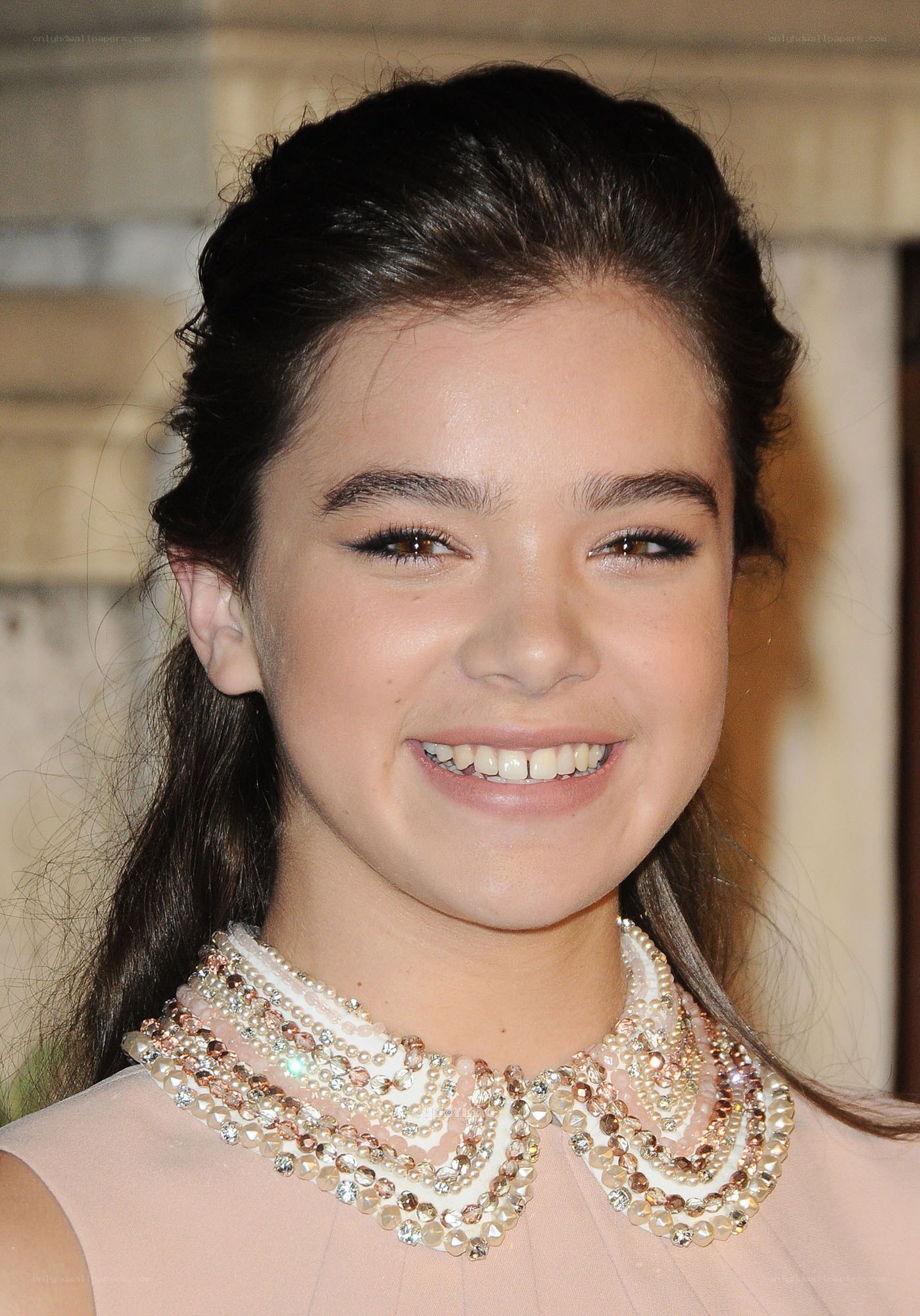 young girl with beaded collar