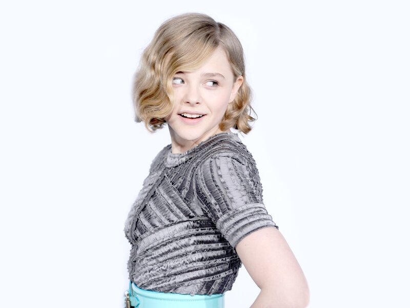Young Girl with Blonde Hair — White, Playful